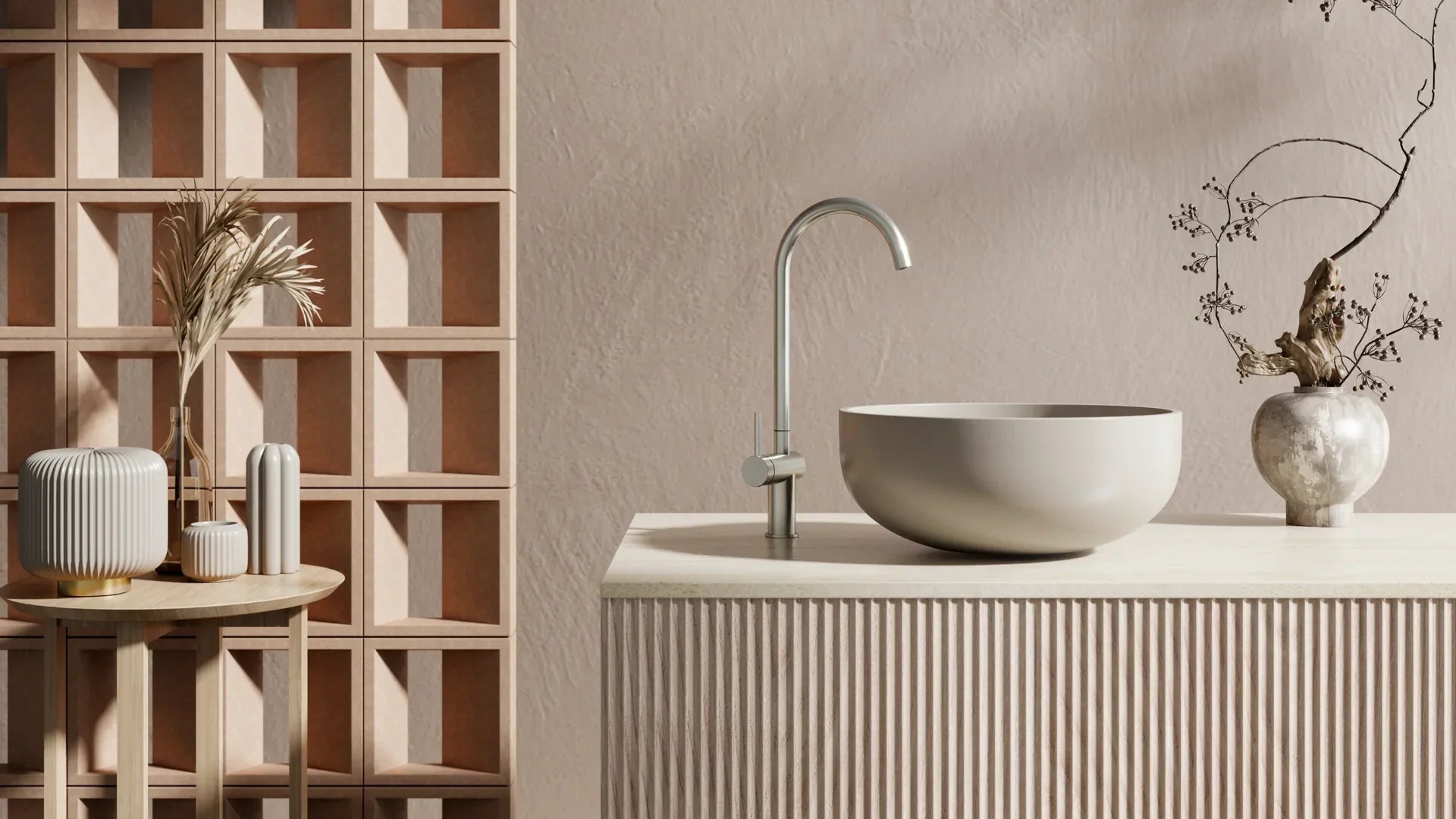 Modern bathroom vanity with round basin and brushed metal tapware, styled with minimalist decor