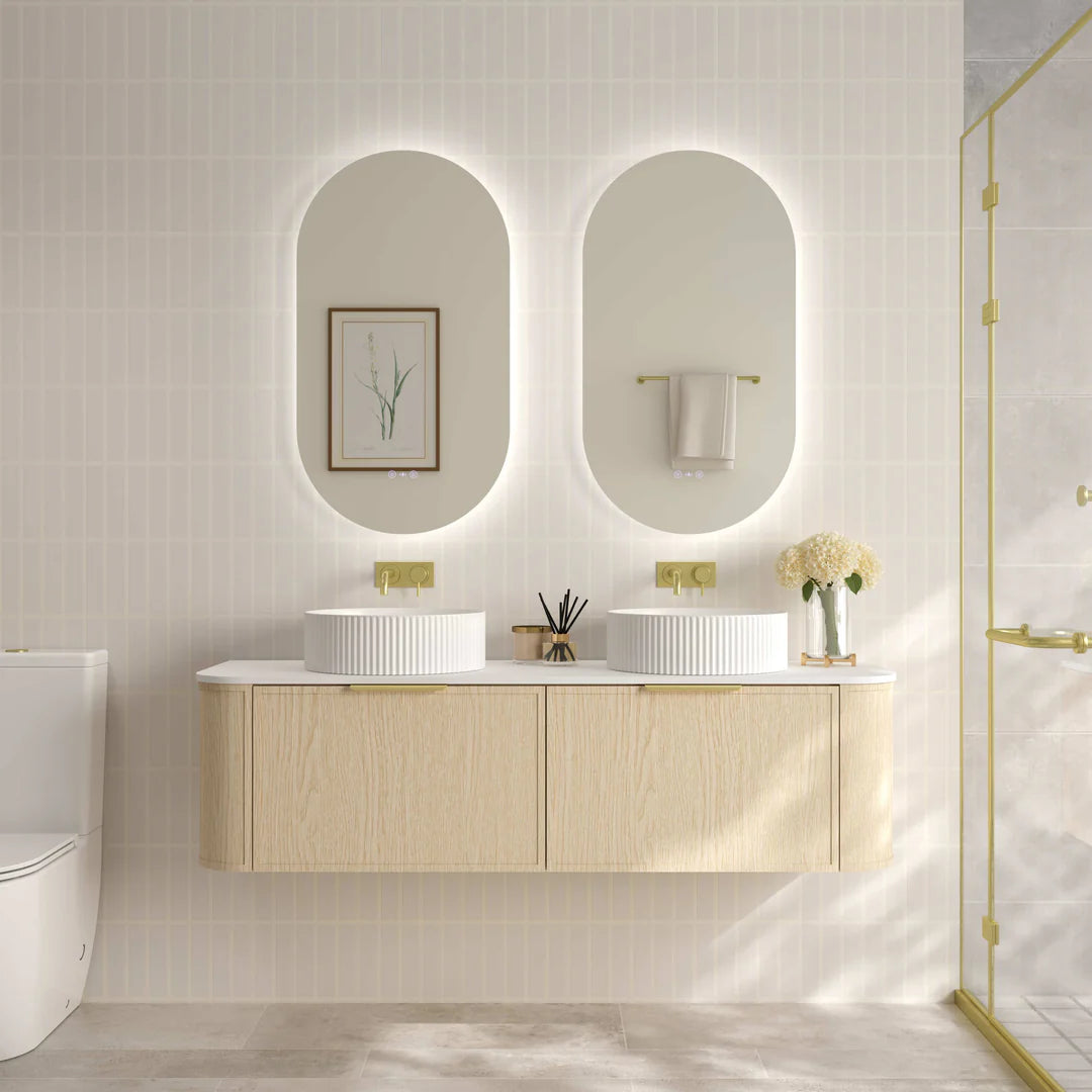 Mercio Elva 1490mm Curved Wall-Hung Vanity in Natural Oak, showcasing its dual counter-top basins, two spacious soft-close drawers, and elegant rounded edges in a contemporary bathroom.