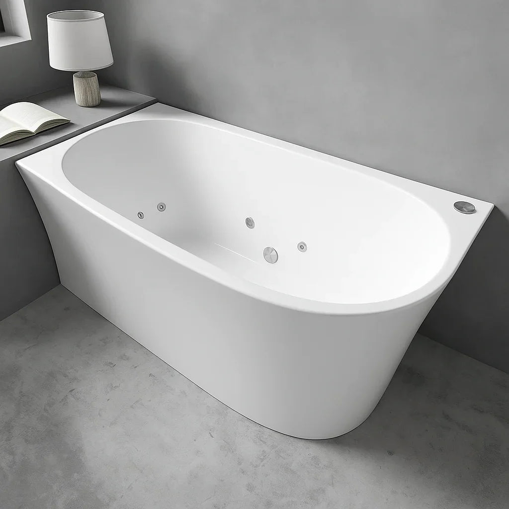 Modern white back-to-wall freestanding spa bath in minimalist bathroom setting
