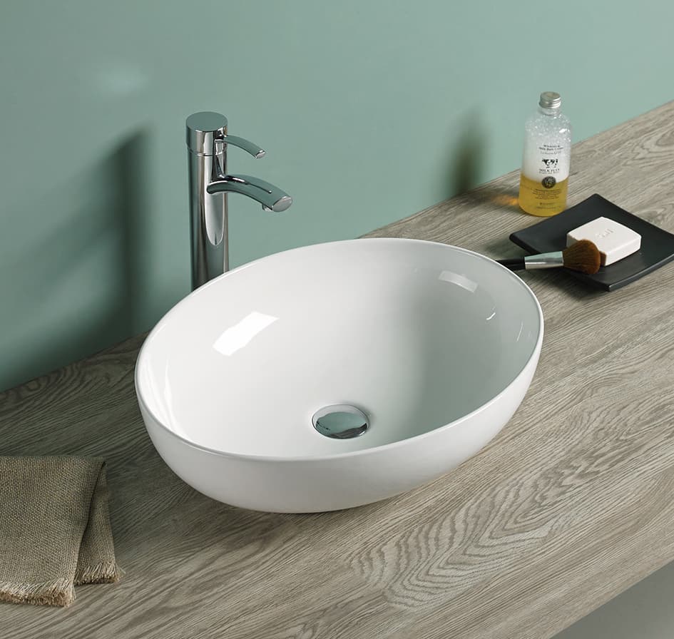 Lukka Carey 520mm oval fine ceramic above counter basin (LK-CRA520) in Gloss White, featuring a seamless, no-overflow design.