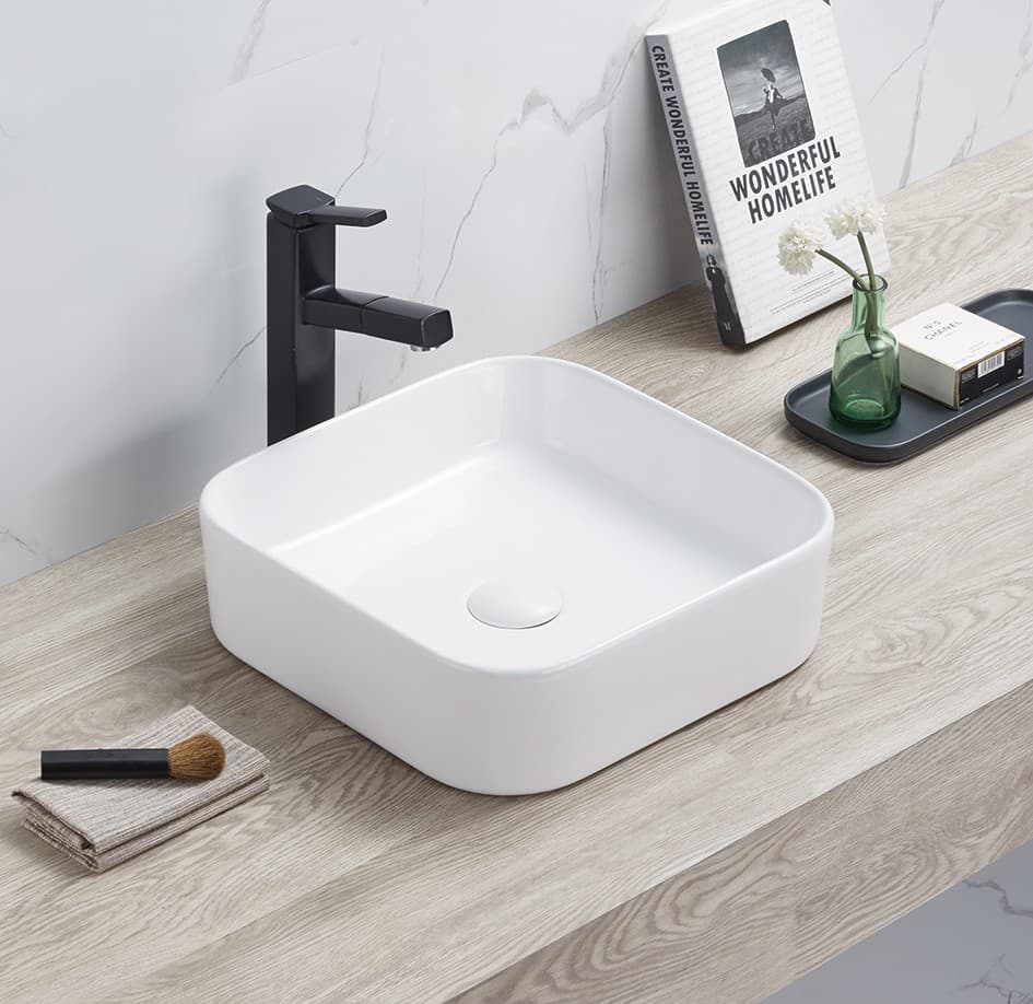 Lukka Kliff 370mm sqaure fine ceramic above counter basin with black faucet on a wooden countertop