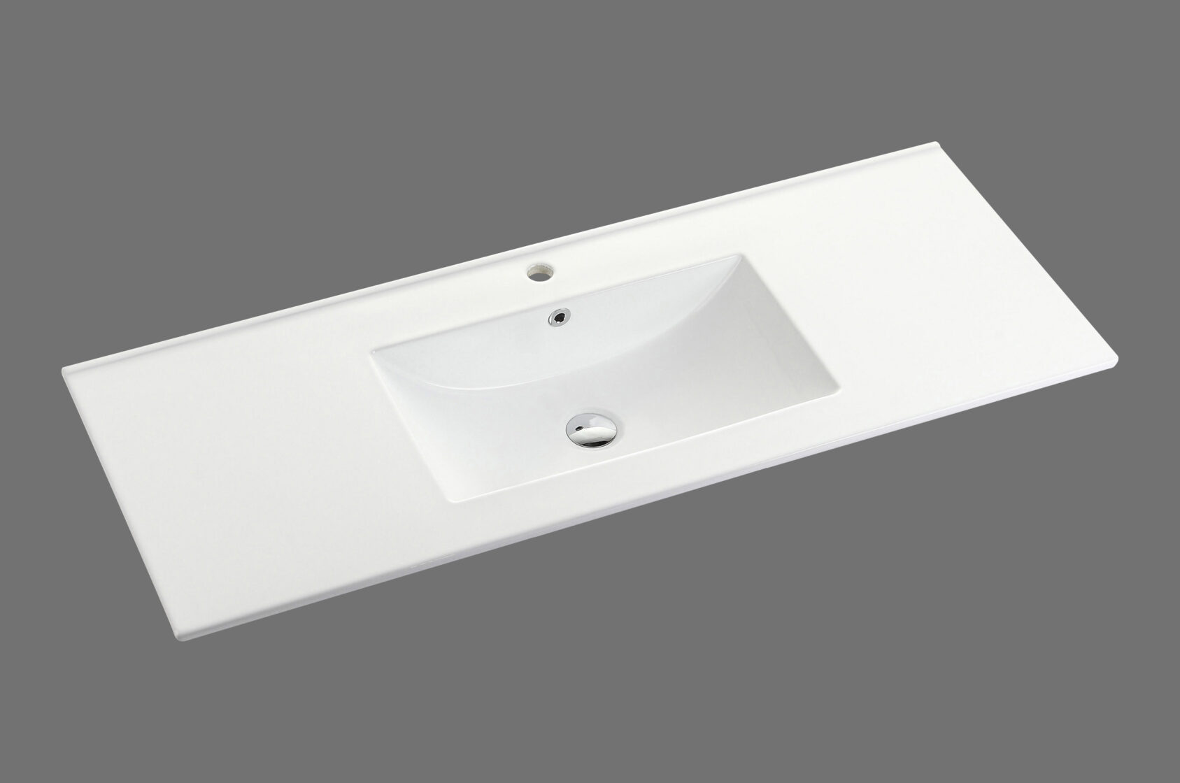 Modern white bathroom vanity top with integrated rectangular basin on grey background