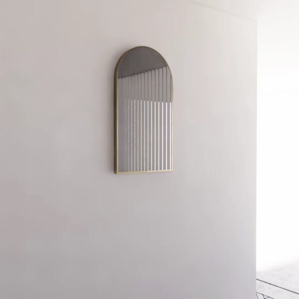 Modern arched bathroom mirror with gold frame and vertical line accents on white wall