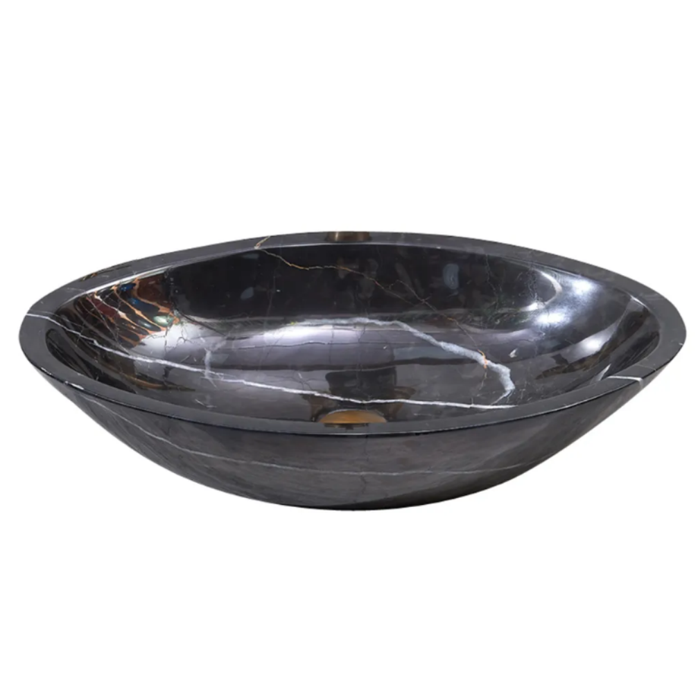 An oval-shaped black marble stone above counter art basin.