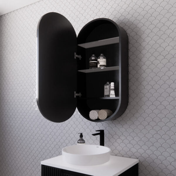 Modern black oval bathroom cabinet with open door above white vanity sink, Secasa Home