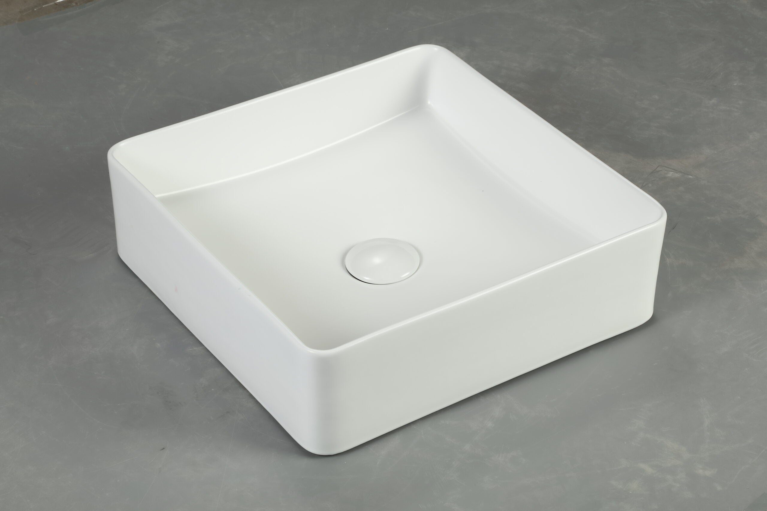 Modern square white ceramic bathroom basin on grey surface, Secasa Home sink