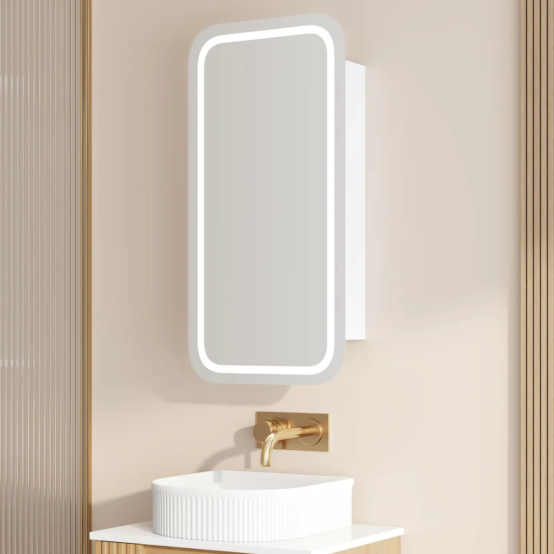 Modern bathroom vanity with LED mirror, gold faucet, and ribbed white basin by Secasa Home