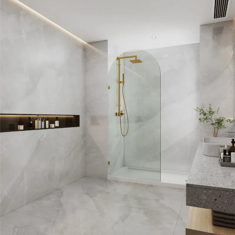 Covey frameless walk-in top arch clear glass shower screen panel with brushed gold fitting finish in a contemporary bathroom
