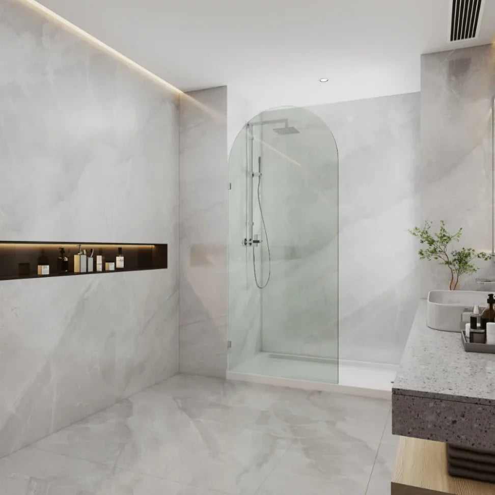 Covey frameless walk-in top arch clear glass shower screen panel with chrome fitting finish in a contemporary bathroom