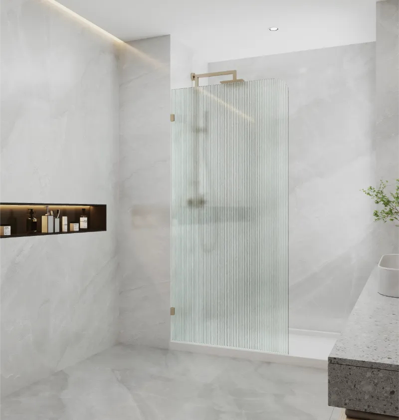 Covey frameless walk-in curved corner fluted glass shower screen panel with brushed Brushed Bronze fitting finish in modern bathroom