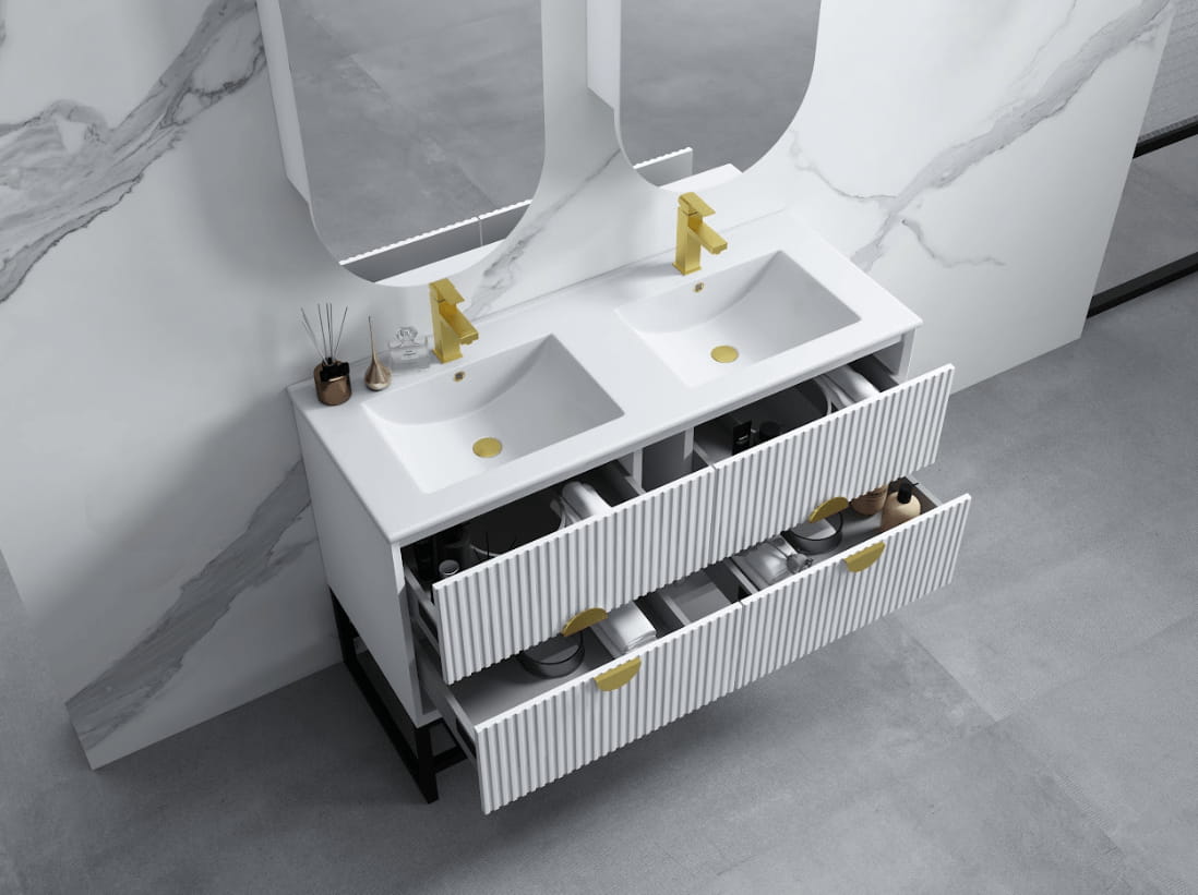 Modern white double bathroom vanity with gold handles and faucets, open drawers, marble wall