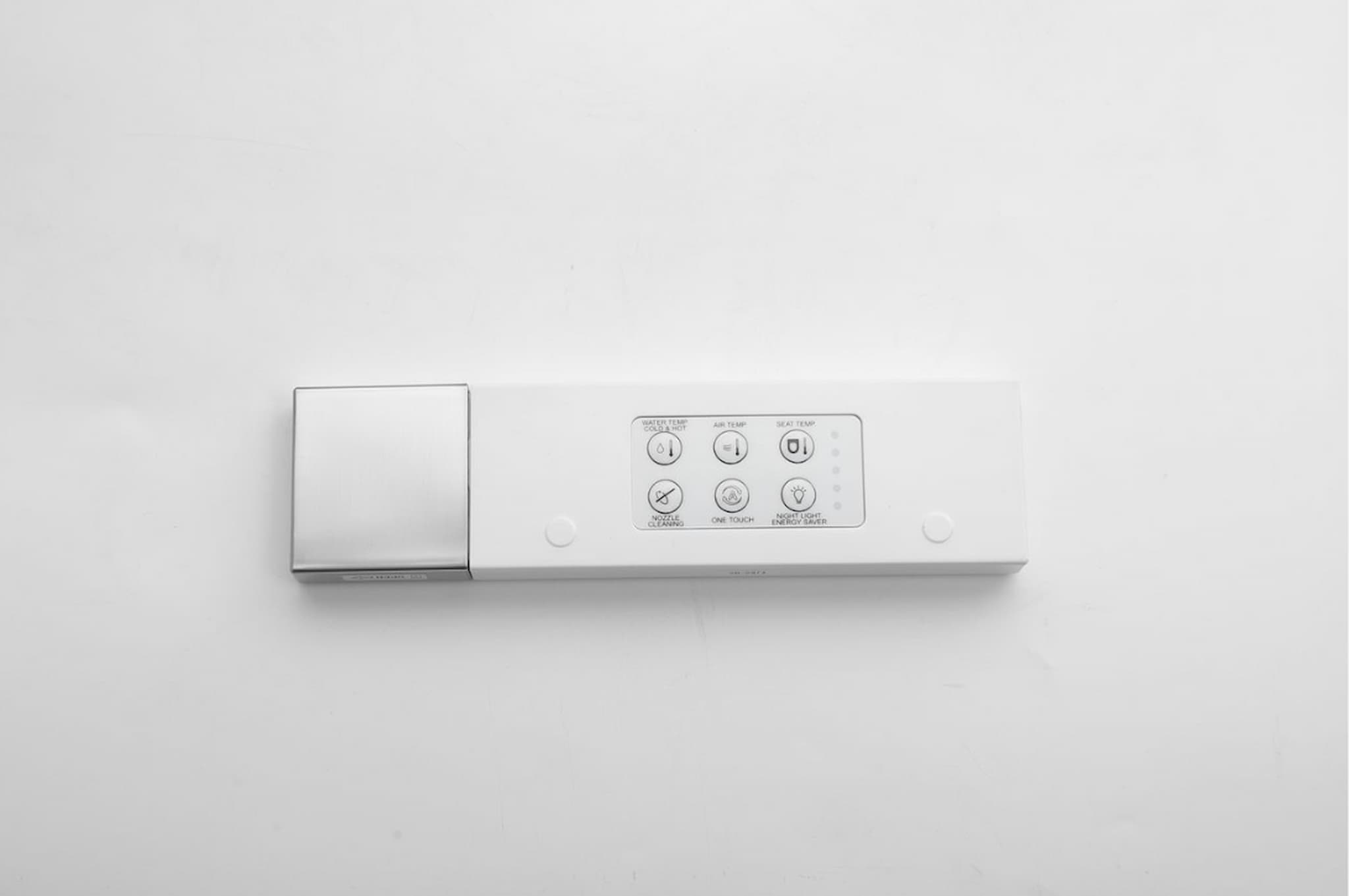Close-up of the Lukka SAMOS Smart Toilet remote control with user-friendly buttons.