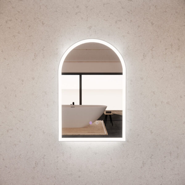 Modern arched LED backlit bathroom mirror reflecting a freestanding bath and minimalist decor