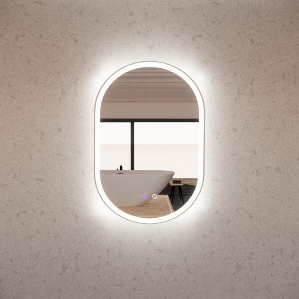 Oval LED bathroom mirror on modern wall reflecting a stylish freestanding bathtub