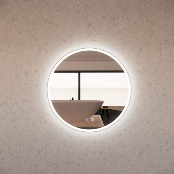 Round LED bathroom mirror reflecting modern freestanding bath in minimalist setting
