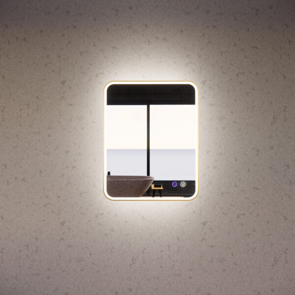 Modern LED bathroom mirror with touch controls and backlit frame, mounted on a light grey wall.