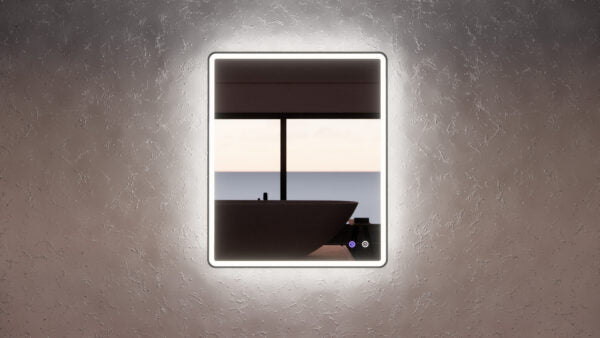 Modern backlit bathroom mirror above a freestanding bath with a scenic window view