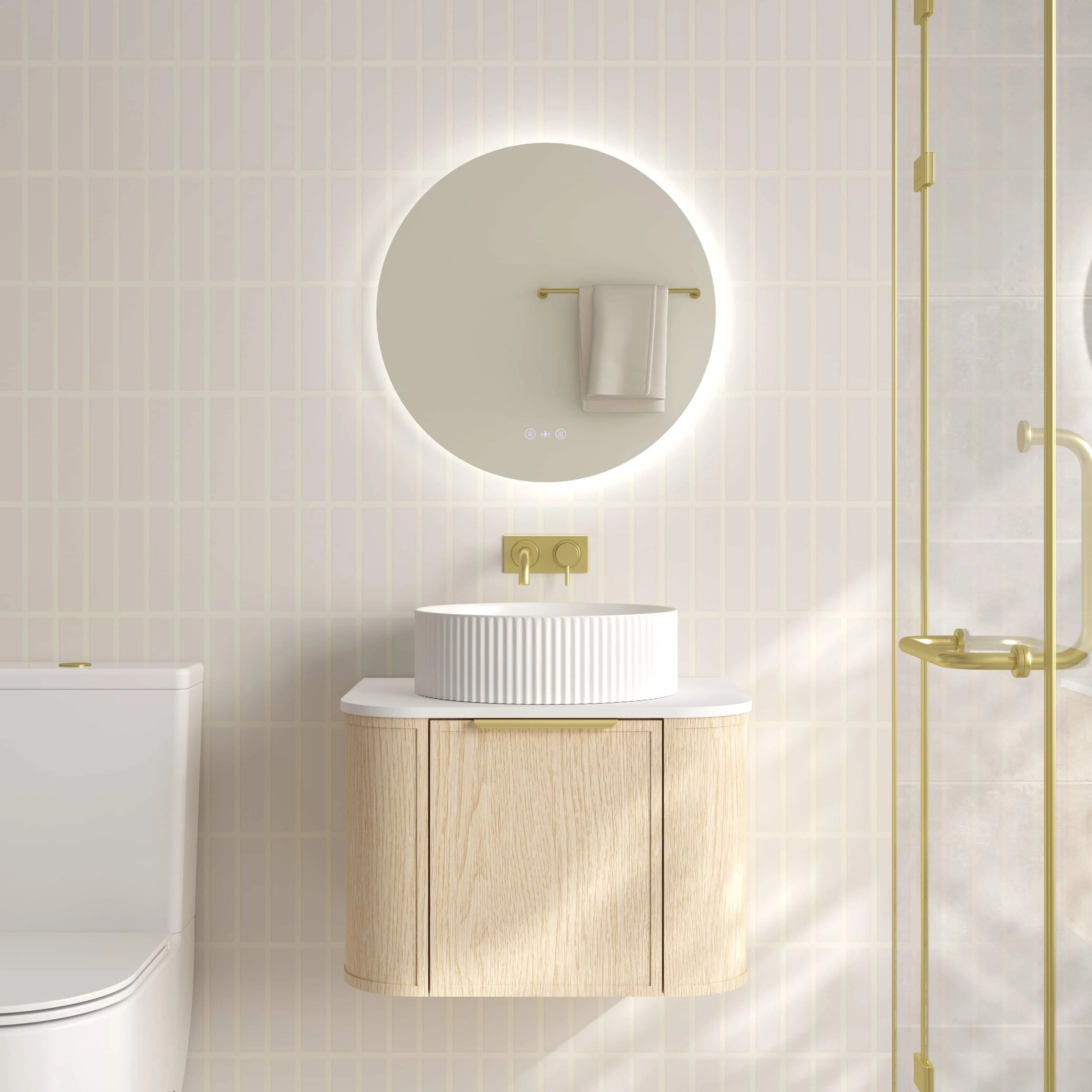 Mercio Elva 590mm Curved Wall-Hung Vanity in Natural Oak, featuring a single soft-close door and rounded edges, elegantly styled in a modern bathroom setting with a counter-top basin.