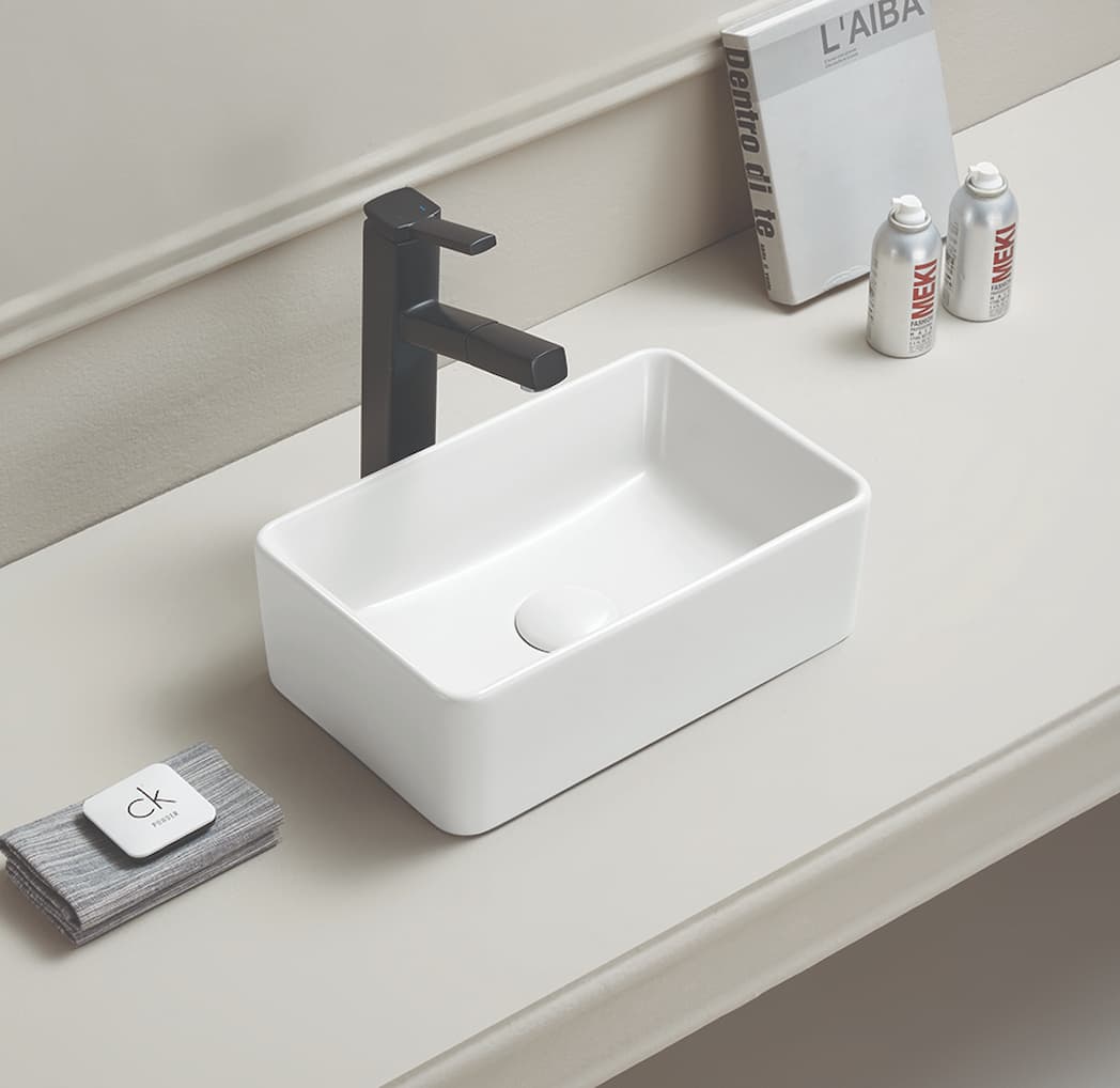 Minimalist bathroom vanity setup showing the compact Crete basin installed on a benchtop.