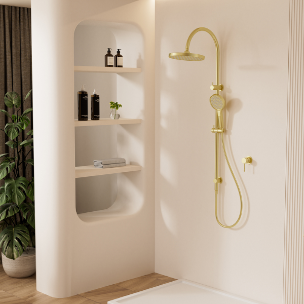 Modern bathroom with gold shower head and hose mounted on a white wall.