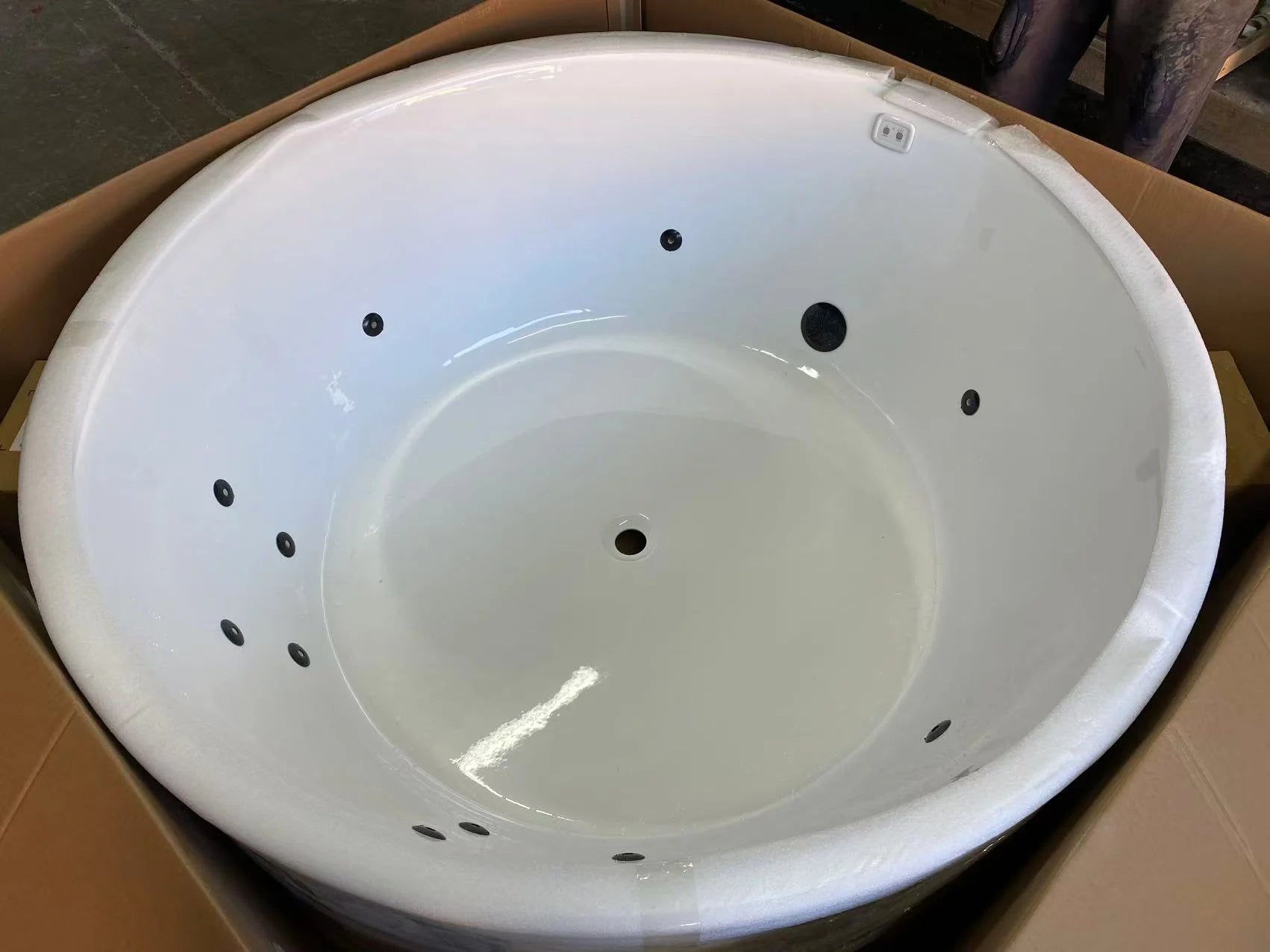 Close-up of the 12 air jets and electronic touch control pad on the Broadway FS19 round spa.