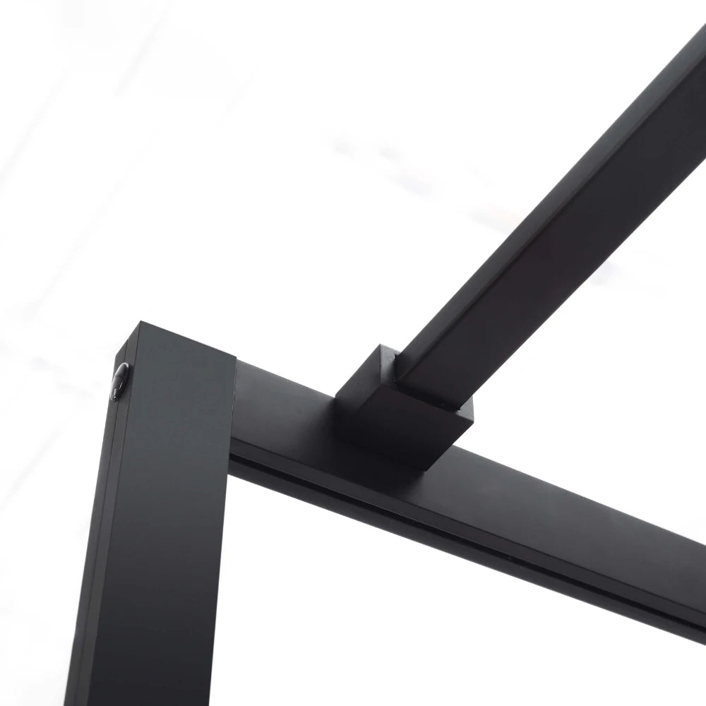 Close-up of a black metal frame on a Covey matte black framed walk-in shower screen