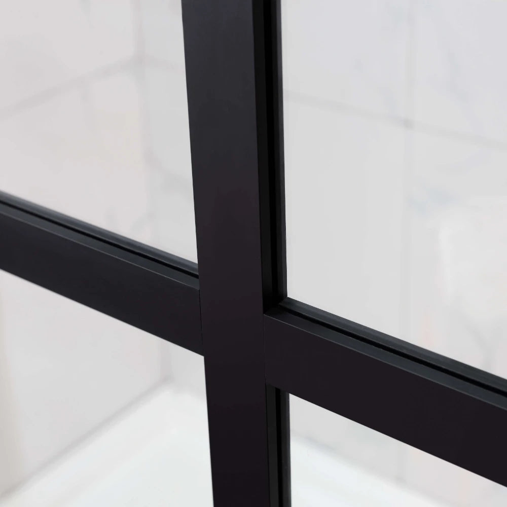 Close-up of a window frame with black metal bars on Covey matte black framed walk-in shower screen