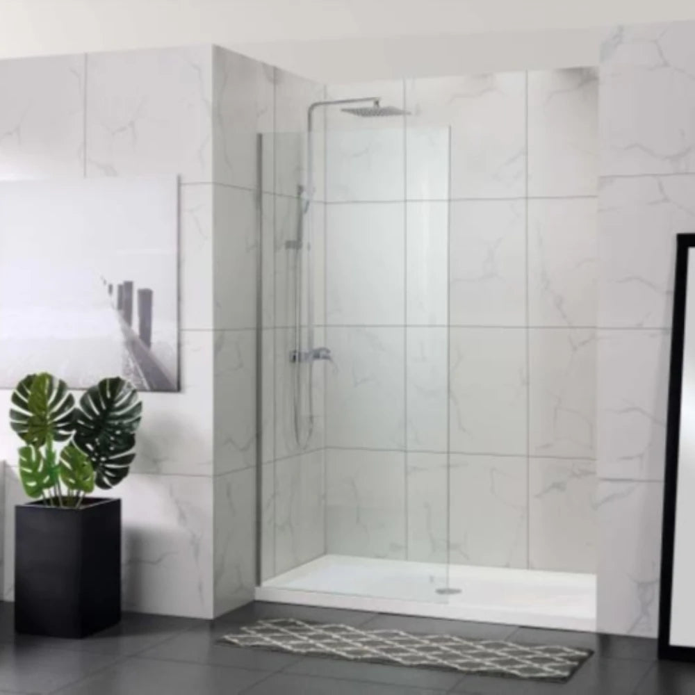 Modern bathroom with a Covey frameless walk-in clear shower enclosure, plant, and rug.