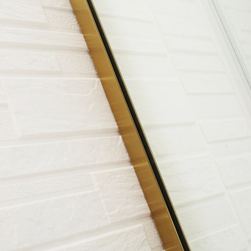 covey-clear-shower-screen-u-channel Close-up of a textured white surface with a gold border