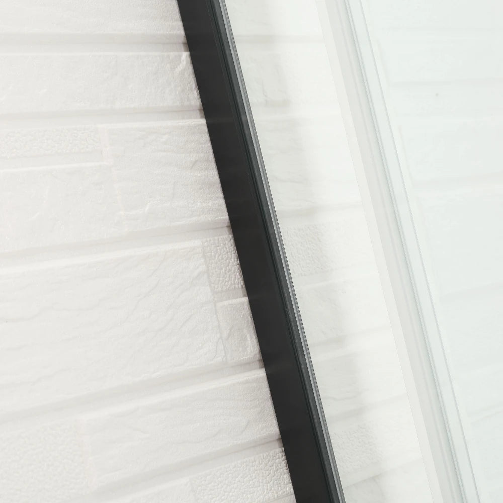 Close-up of a black rectangular object on a white textured surface