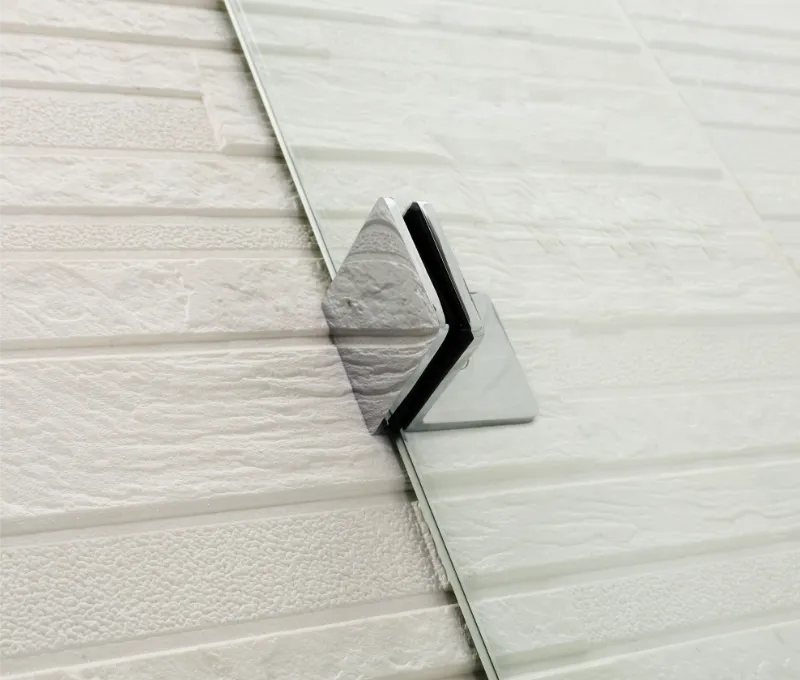 Close-up of a Covey CVP007 shower panel with a metallic corner piece on a textured white background