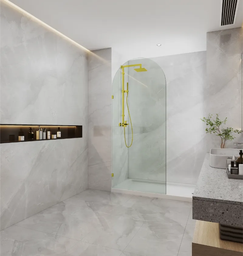 Covey frameless walk-in top arch clear glass shower screen panel with light gold fitting finish in a contemporary bathroom
