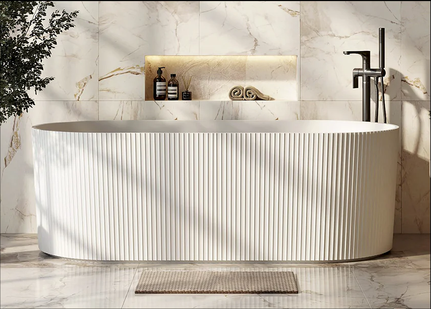 Modern freestanding bathtub with fluted design in a luxury bathroom interior.