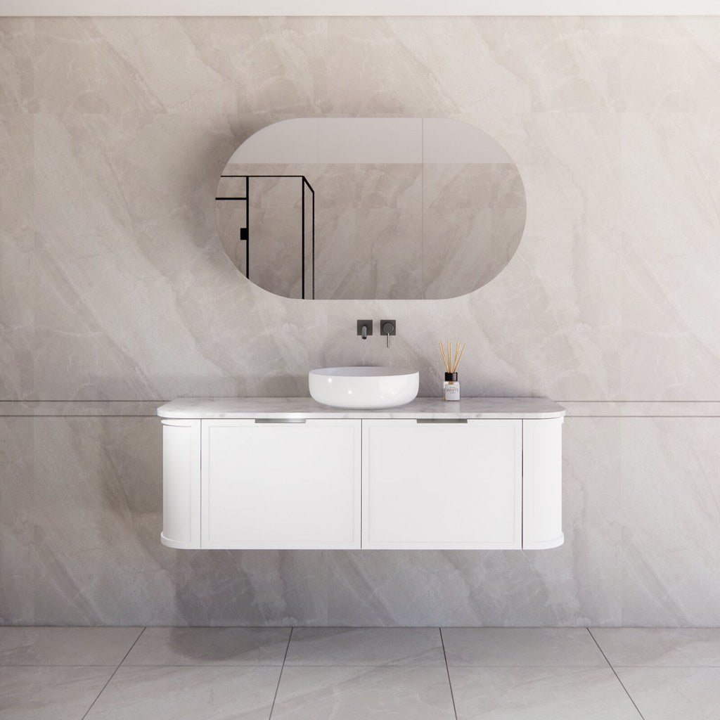 Modern bathroom featuring the Houston matte white curved wall hung vanity 1500mm with gun metal handles, creating a spacious and contemporary feel.