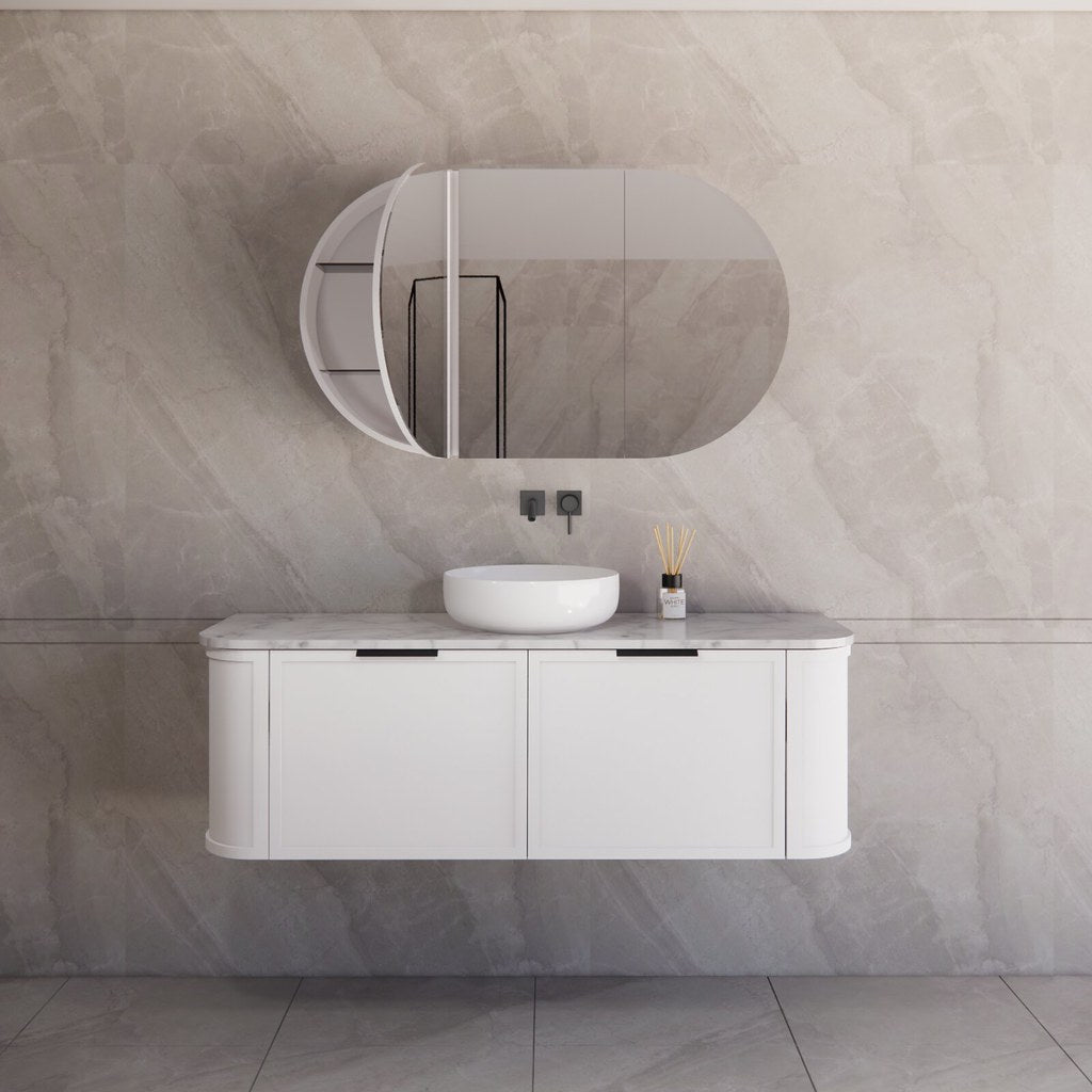 Modern bathroom featuring the Houston matte white curved wall hung vanity 1500mm with matt blackhandles,  signle bowl creating a spacious and contemporary feel.