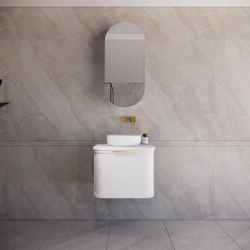 Modern bathroom featuring the Houston matte white curved wall hung vanity 600mm with brushed gold handles, creating a spacious and contemporary feel.