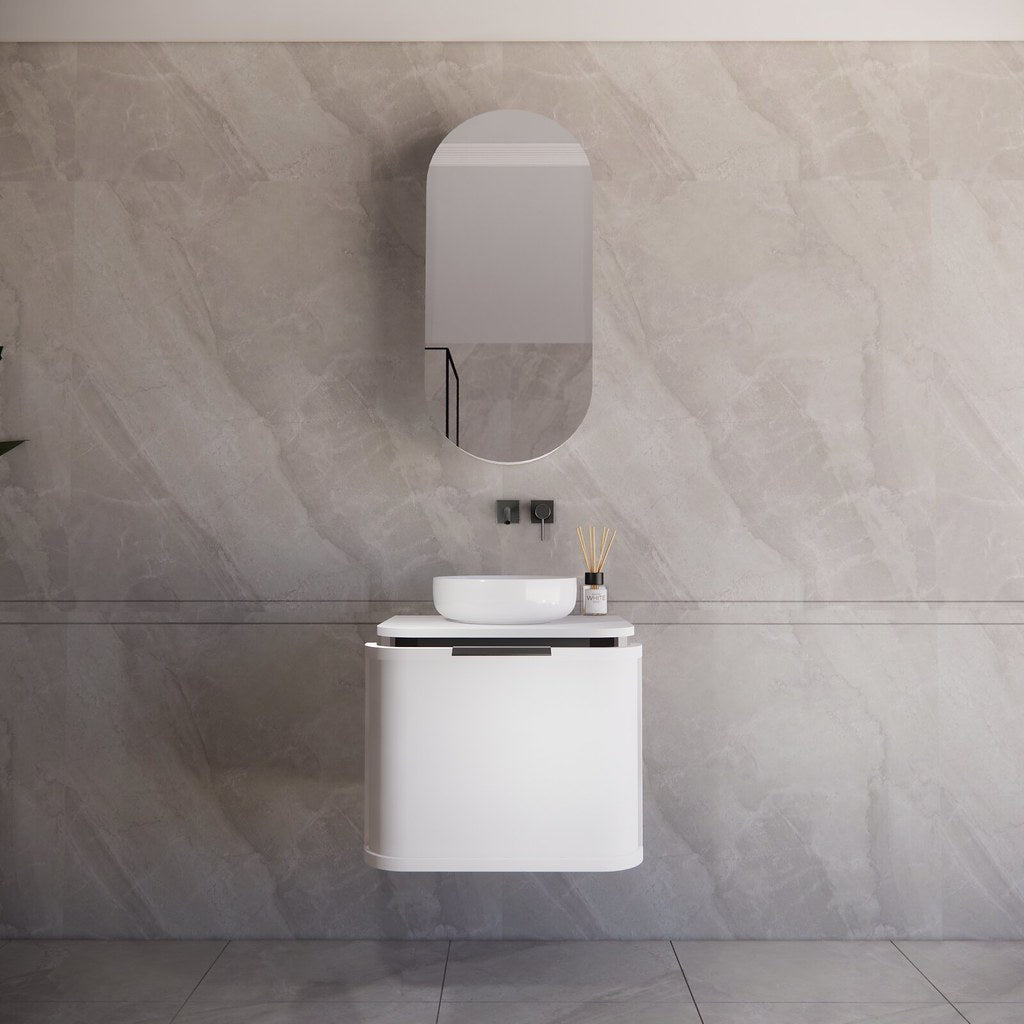 Modern bathroom featuring the Houston matte white curved wall hung vanity 600mm with gun metal handles, creating a spacious and contemporary feel.