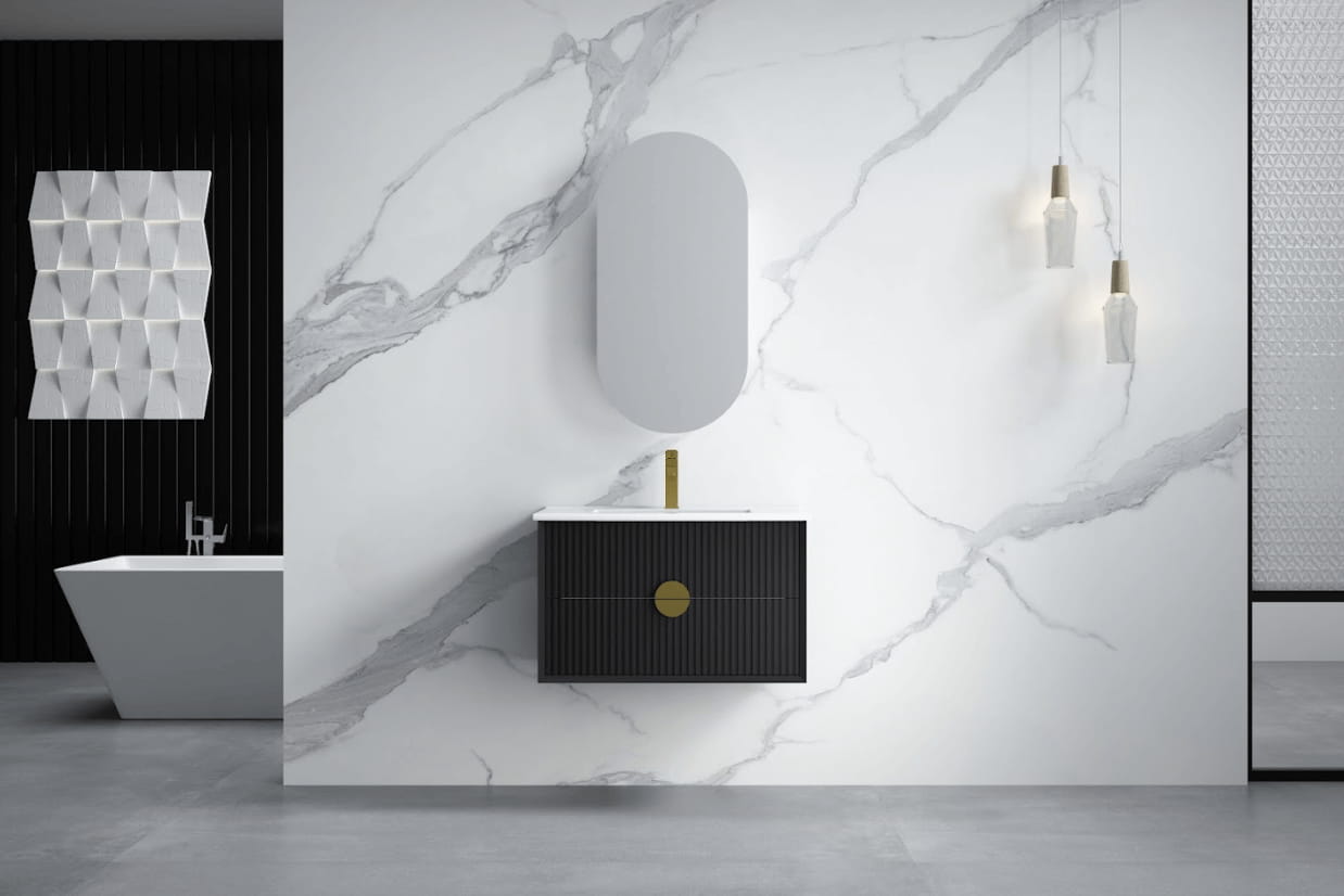 Modern bathroom with wall-hung black vanity, oval mirror, pendant lights, and marble wall.
