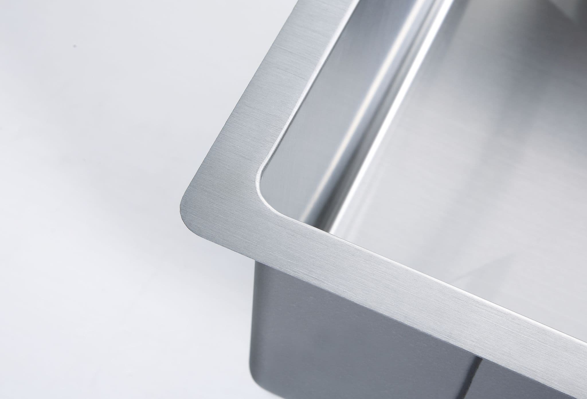 Close-up of the R15 radius corners on a Kliff handmade stainless steel sink for easy cleaning.