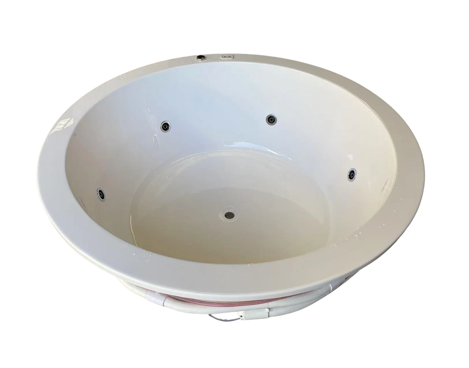 Underside view of the Lucena Round Spa Bath showing pump connections and structural support