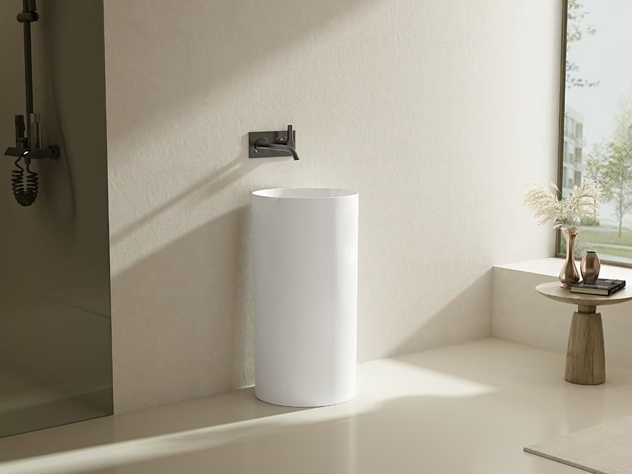 Lukka Carrida Fine Ceramic Free Standing Pedestal Basin, round shape, 445×455×860 mm, Matte White finish  in a modern bathroom setting with a window and decorative items.