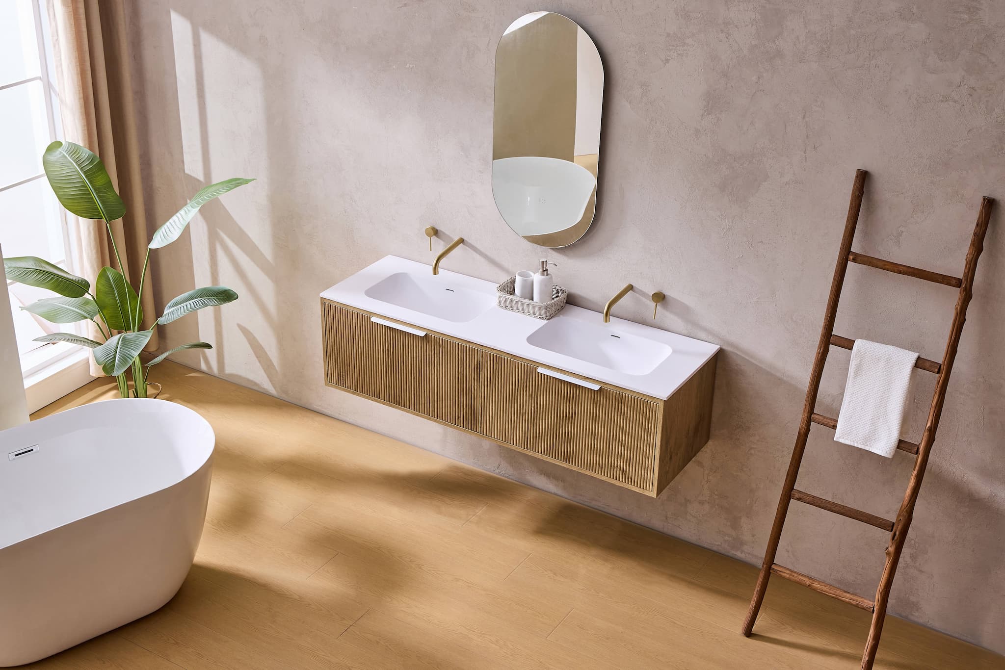 Modern bathroom with oak double basin vanity, freestanding bath, plant, and ladder towel rack