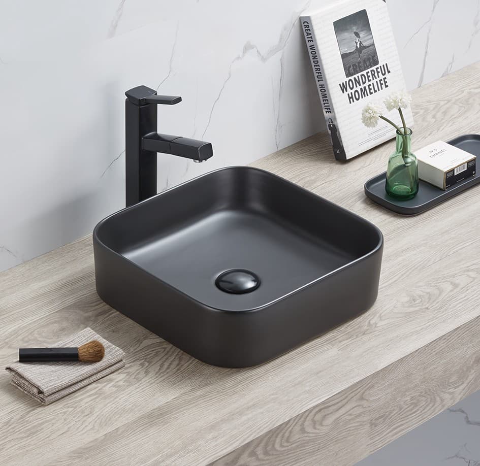Lukka Kliff 370mm square fine ceramic above counter matt black basin with faucet on a wooden countertop