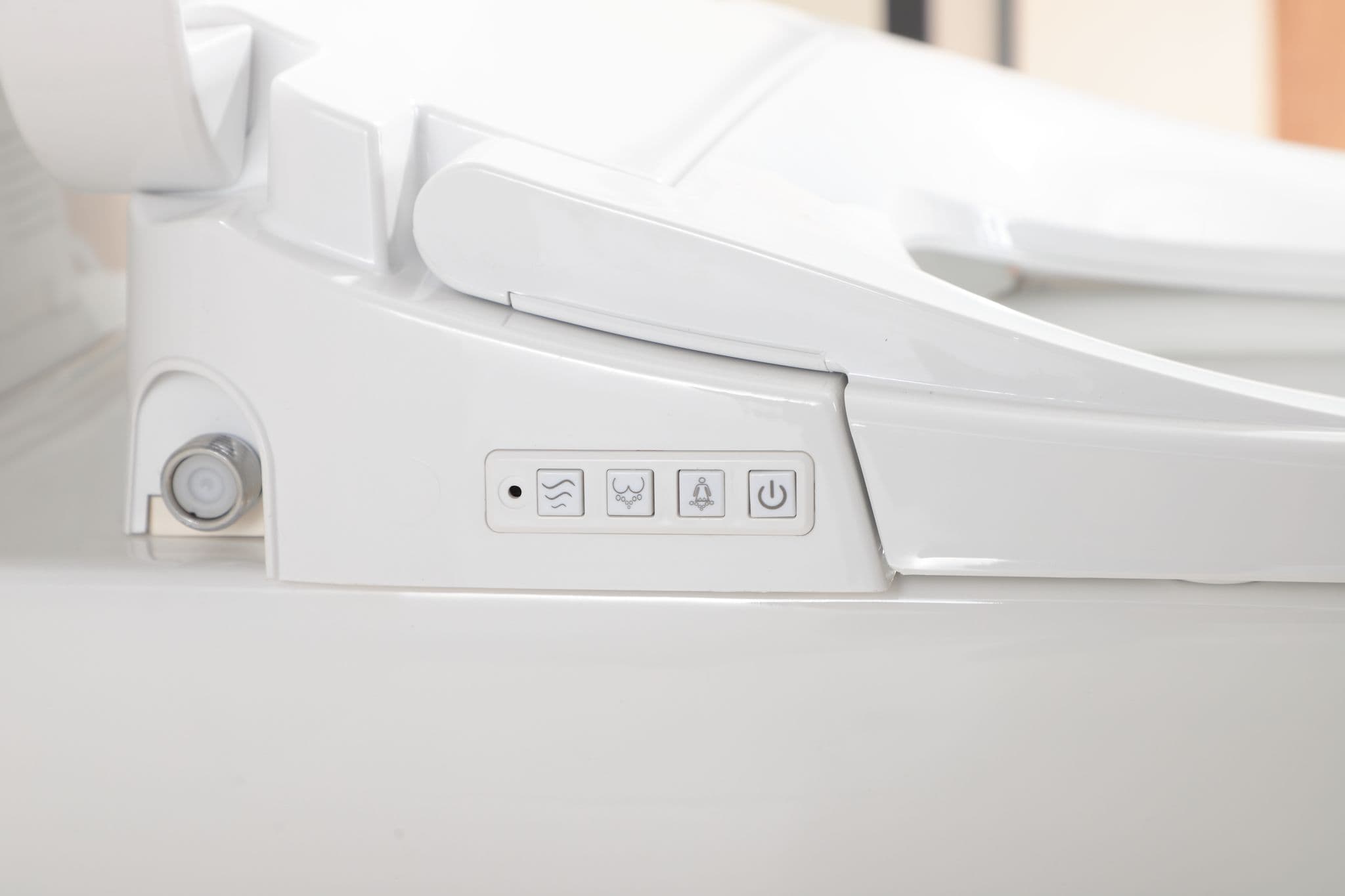 Side control buttons on Lukka Rocca bidet for basic wash functions