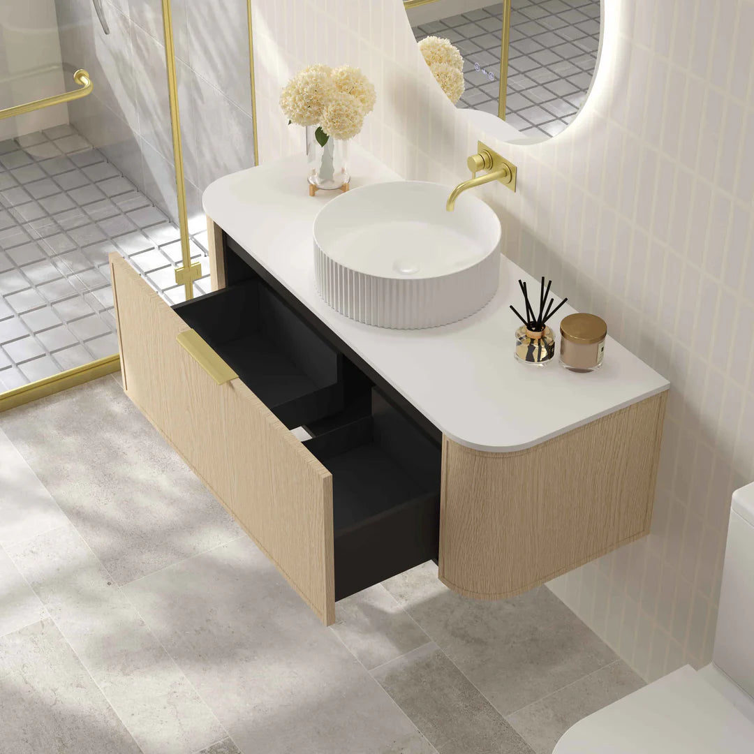 Open view of Mercio Elva 1190mm Curved Wall-Hung Vanity in Natural Oak, showcasing its organized interior storage within a single soft-close drawer.