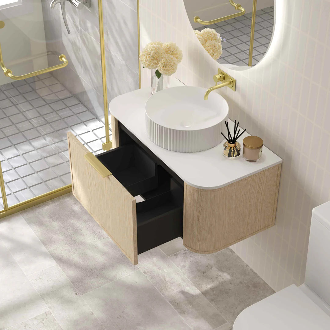 Open view of Mercio Elva 890mm Curved Wall-Hung Vanity in Natural Oak, showcasing its organized interior storage within a single soft-close drawer.