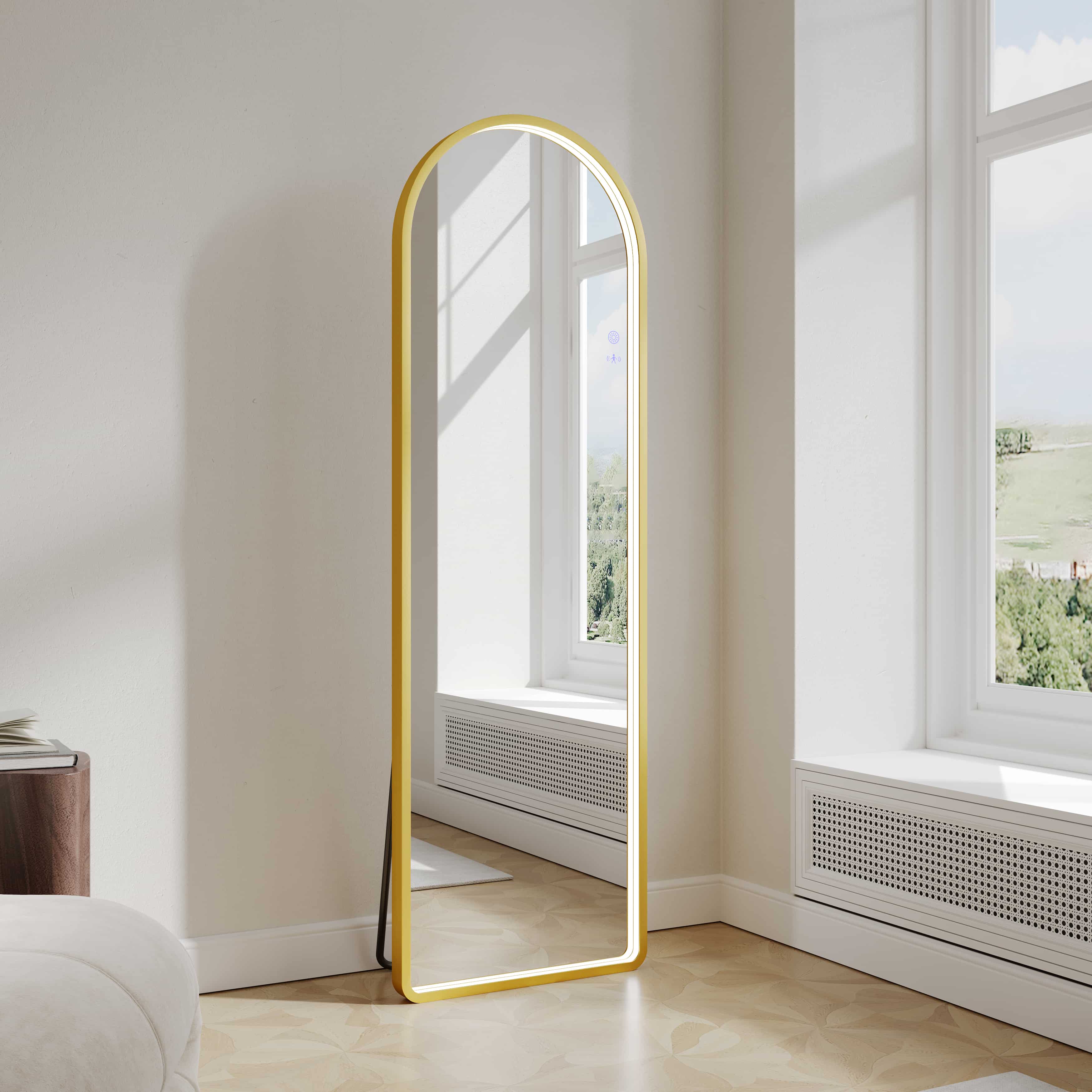 Mercio Saga 500x1600mm Freestanding LED Arch Mirror in Brushed Gold finish, full view in a modern living space or dressing room.