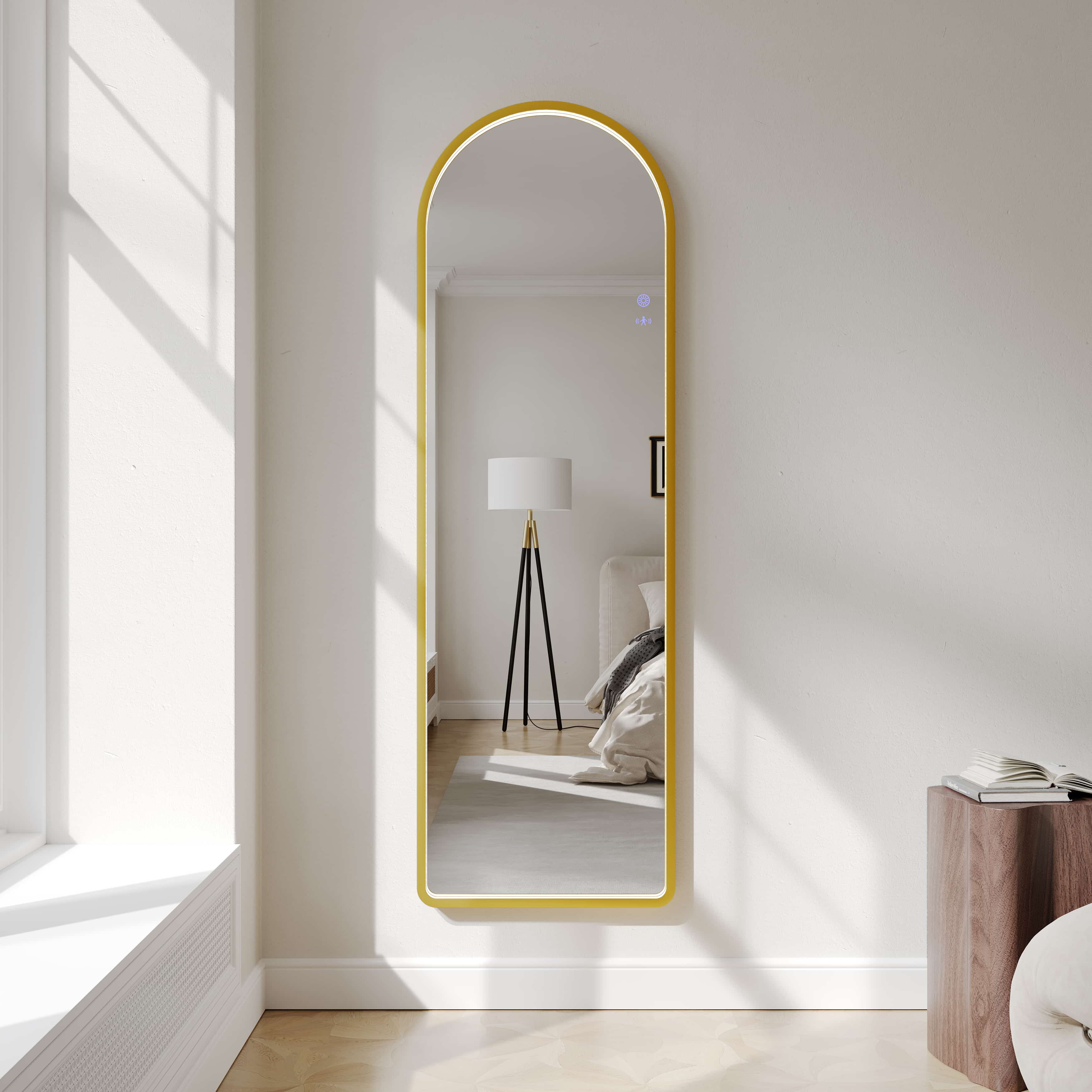 Mercio Saga 500x1600mm wall-mounted arch LED mirror with brushed gold frame in modern bedroom
