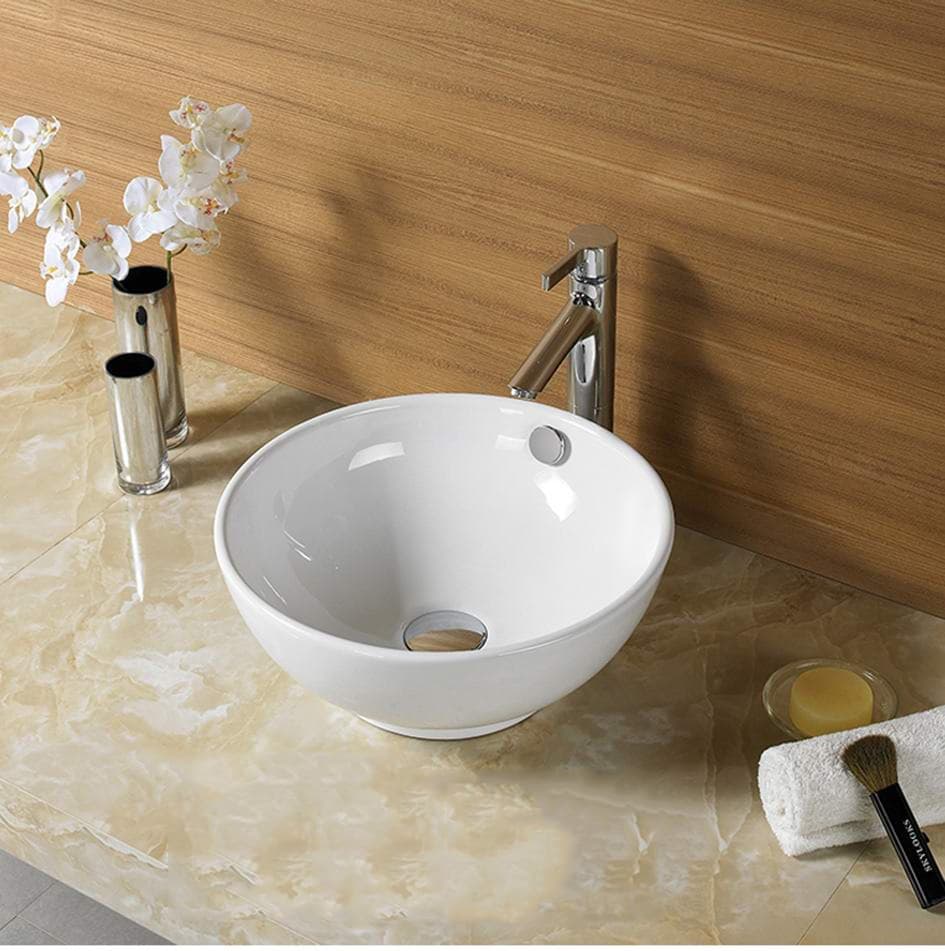 Orbi Fine Ceramic Above Counter Basin in Gloss White finish on a beige countertop with a wooden wall background