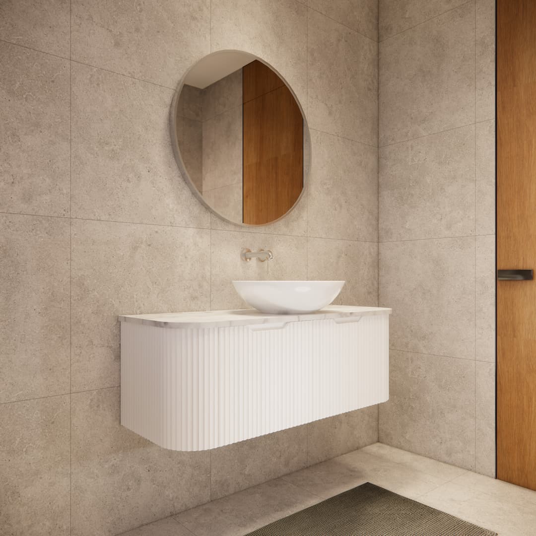 Modern bathroom with a Secasa Home curved matte white wall-hung vanity and round mirror